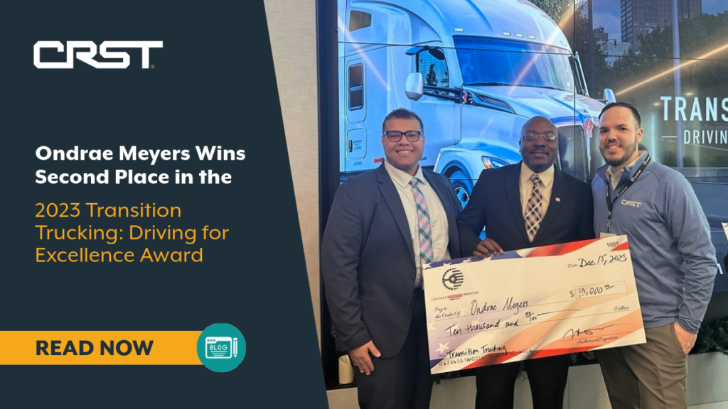 CRST driver Ondrae Meyers stands with a $10,000 check, alongside event officials, celebrating his second-place win in the 2023 Transition Trucking: Driving for Excellence Award.